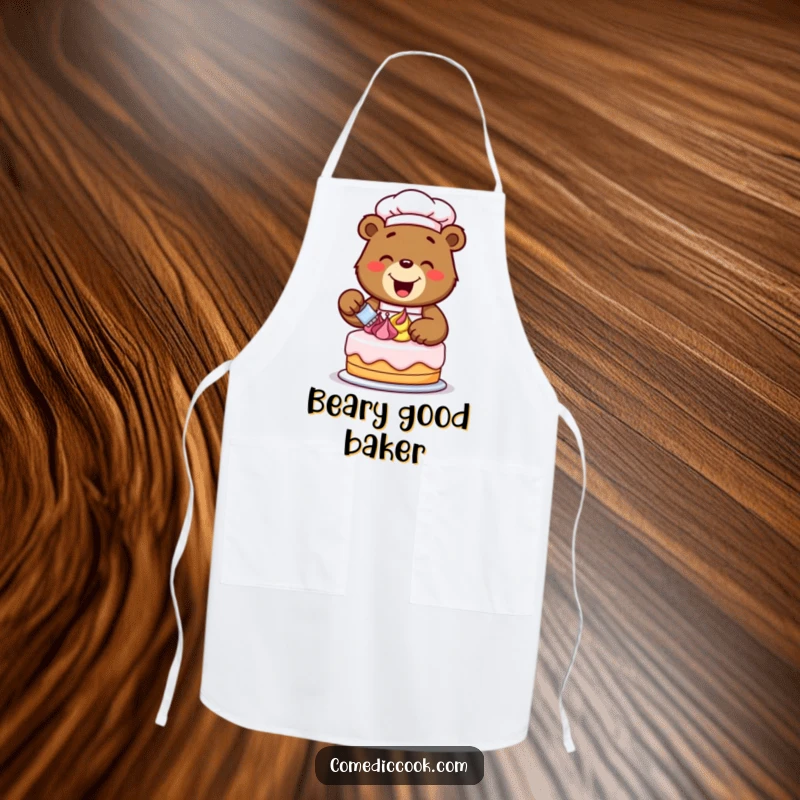 Funny happy bear chef excitedly decorating a cake with colorful frosting swirls, printed on a durable apron for sweet creations.