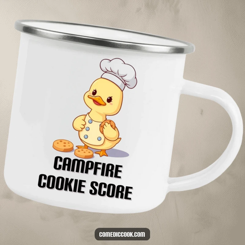 Funny smiling duckling chef carefully gathering a tiny cookie on a durable camping mug for outdoor fun.