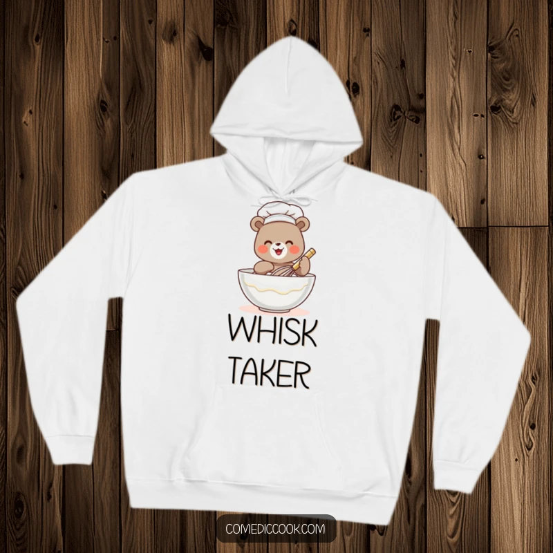 Funny bear chef hoodie showing a tiny bear cheerfully whisking batter, perfect for staying warm and laughing, a great gift.
