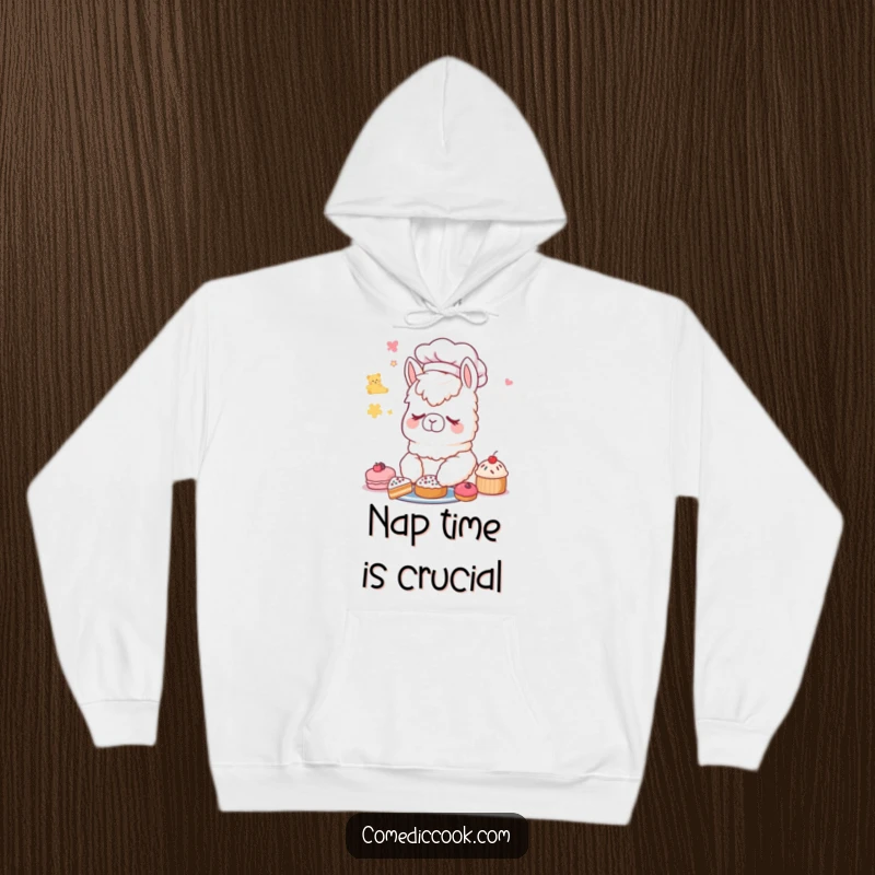 Funny Alpaca Chef Hoodie: A soft hoodie featuring a sleeping alpaca chef dreaming of colorful, delicious pastries.