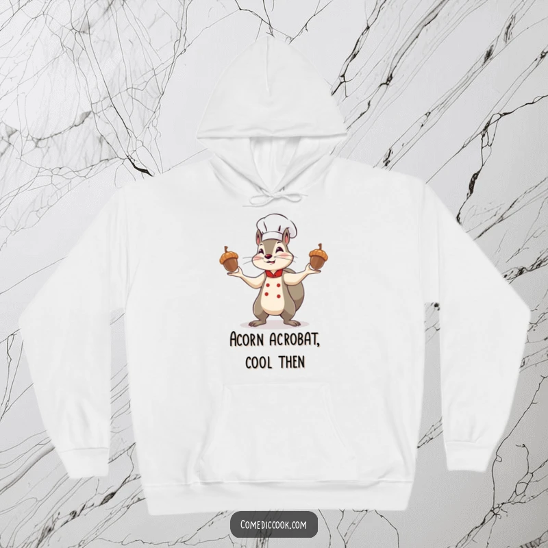 Funny squirrel chef hoodie, a determined character comically juggling shiny acorns, representing kitchen ambition and cozy, humorous style.