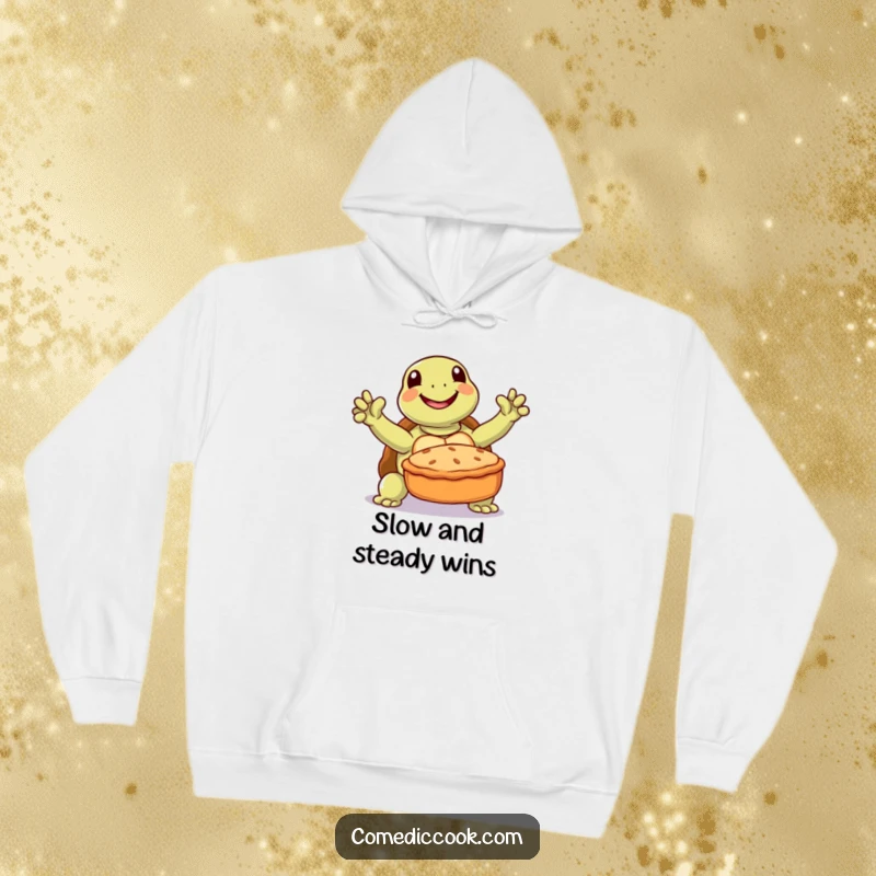 Funny turtle hoodie with a joyful turtle triumphantly presenting a baked pie, perfect for cozy baking sessions.