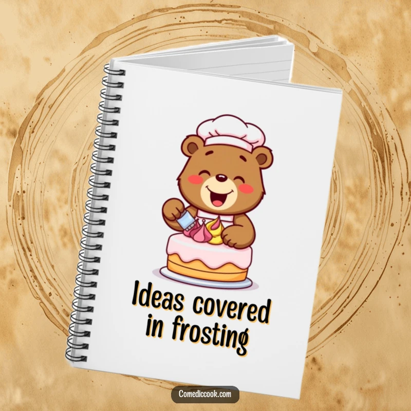 Funny bear chef with a cake, decorating with frosting swirls, featured on the cover of a notebook for recipes and baking ideas.