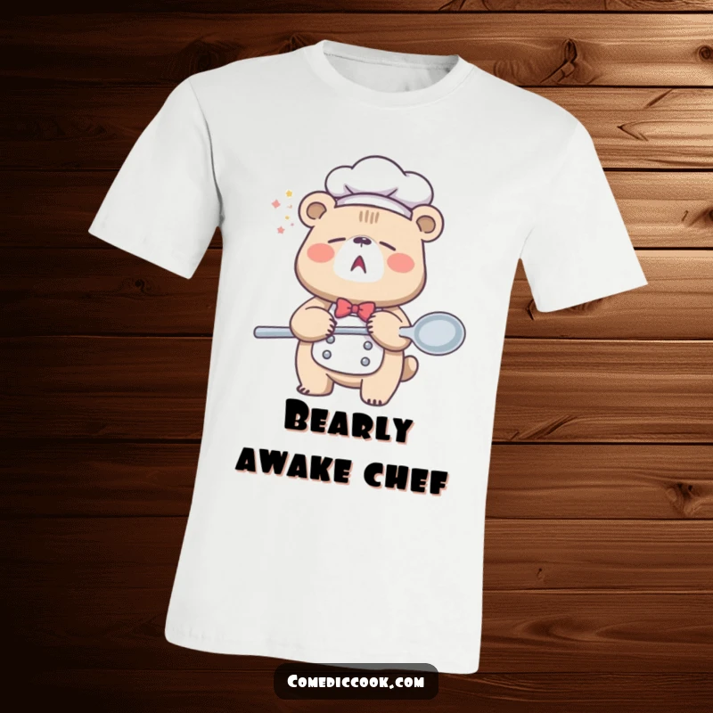 Funny Sleepy Bear Chef T-Shirt featuring a large bear yawning with a massive spoon, capturing the essence of morning hunger and sleepiness humorously.