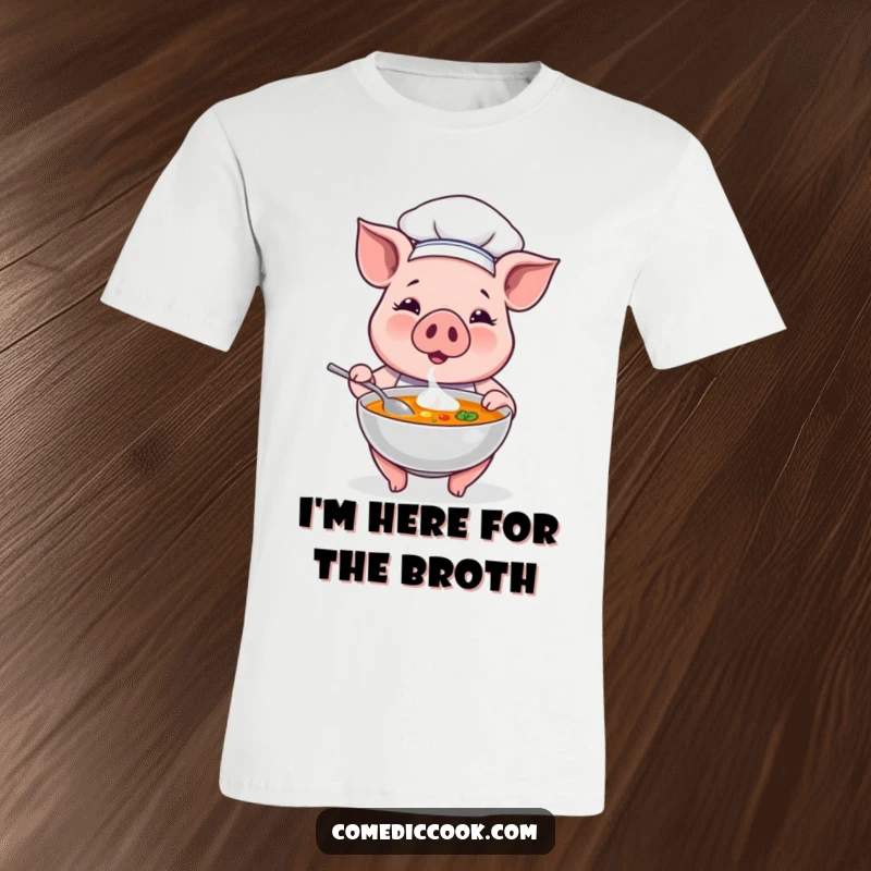 Funny proud pig chef character showcasing a steaming bowl of soup, radiating culinary joy and humor on a comfortable tee.
