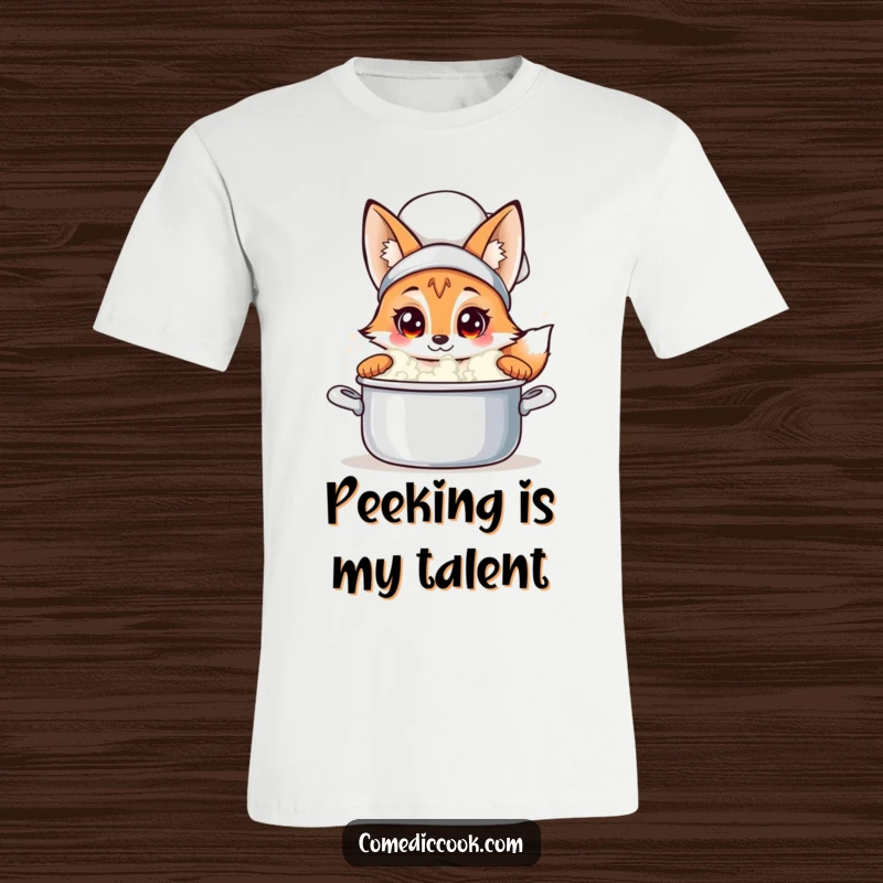 Funny fox chef t-shirt with a curious fox peeking into a bubbling pot, ideal for culinary enthusiasts and humor seekers.