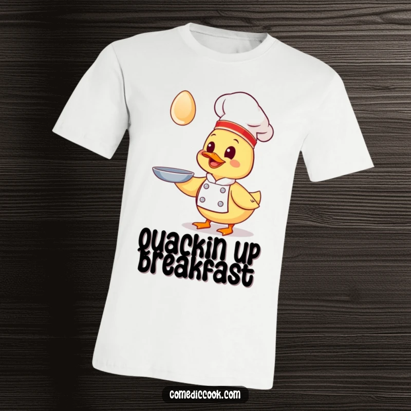 Funny Kawaii duck chef t-shirt, a giggling duck chef attempting to catch a flying egg, vibrant and comical graphic tee.