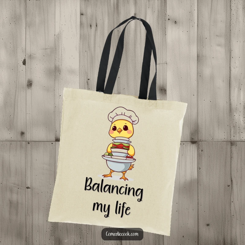 Funny Chick Chef Tote Bag featuring a determined chick balancing a stack of tiny dishes, perfect for carrying essentials with a humorous touch.