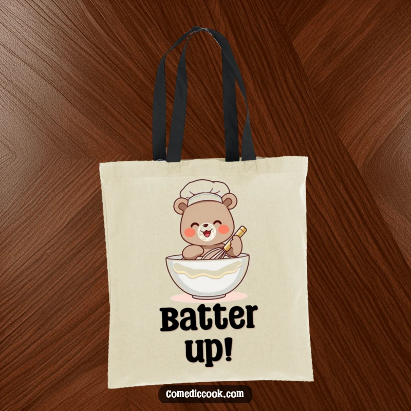 Funny bear chef tote bag depicting a tiny bear whisking batter, ideal for shoppers who appreciate humor and adorable designs.