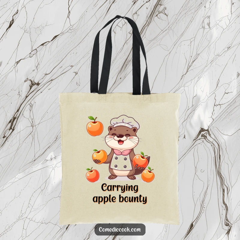 Funny happy otter chef juggling three shiny apples on a stylish and humorous tote bag.